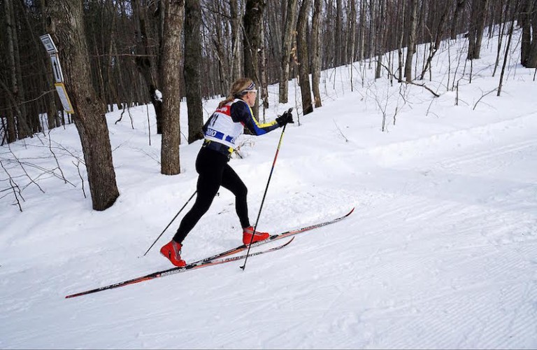 Crosscountry skier going up hill at 2016 Ontario Masters race Bruce