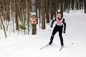 Great Wolf Invitational Cross-Country Ski Race 2017 - skier near fox sign